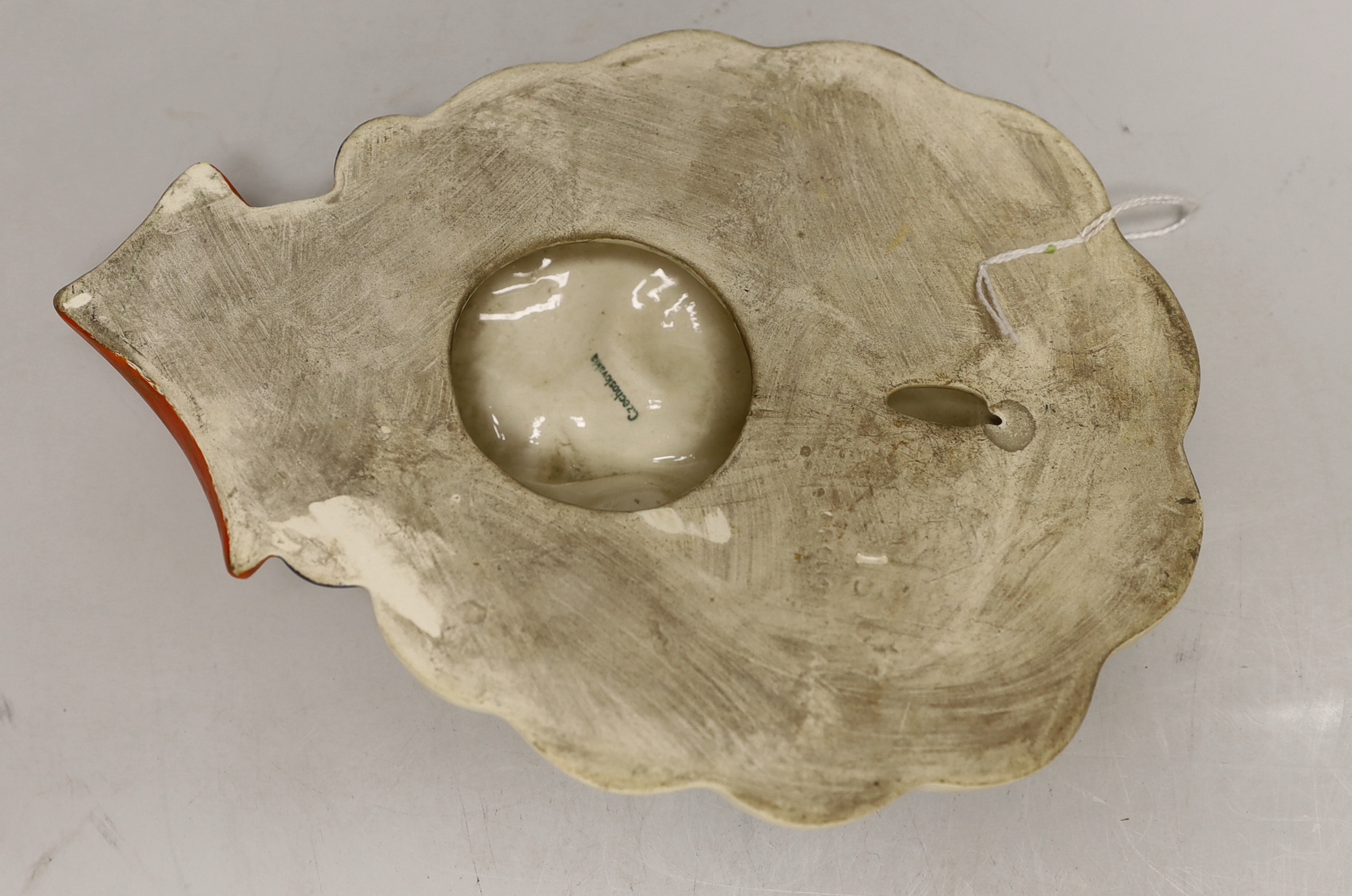 A Czechoslovakian Art Deco face mask, 22cm